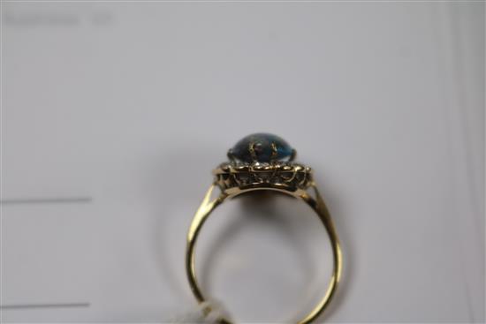 A yellow metal, opal and diamond oval cluster ring, size O.